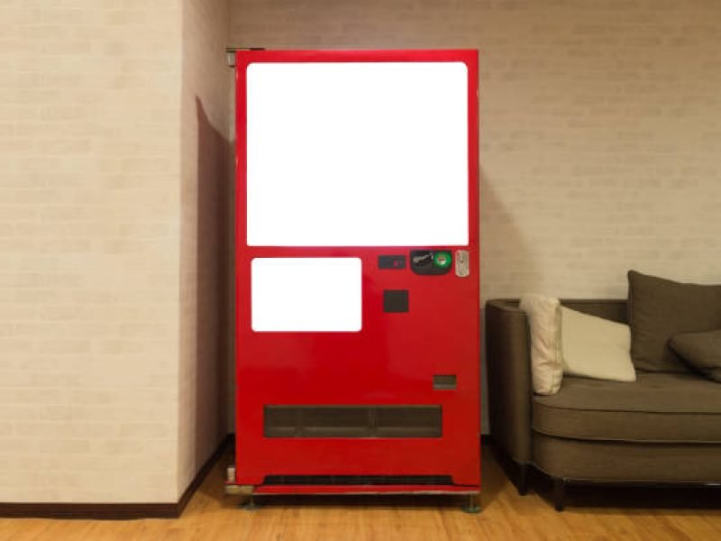 Empty white shelves of standard office vending machine